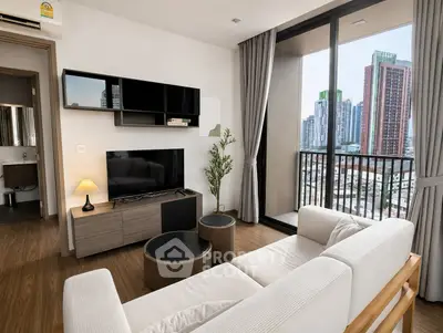 Modern living room with city view, featuring sleek furniture and large windows for natural light.