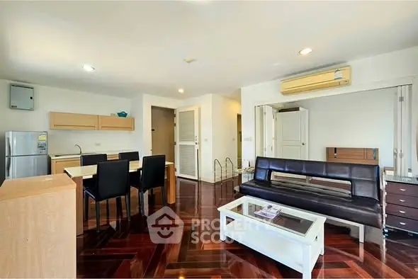 Spacious living room with modern furniture and wooden flooring