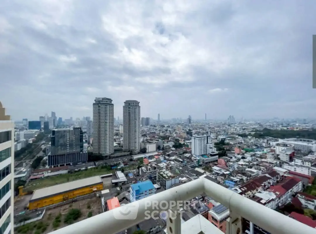 Stunning cityscape view from high-rise balcony showcasing urban skyline and architectural diversity.