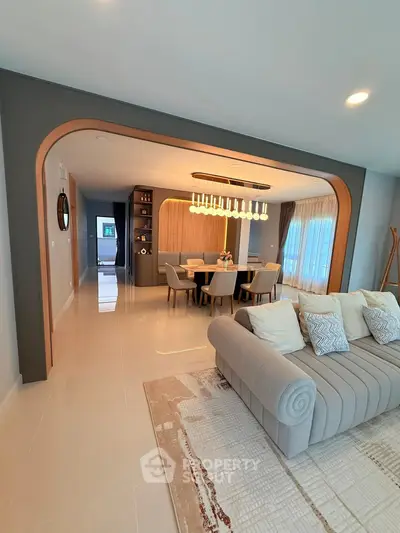 Luxurious open living room with elegant dining area and modern decor