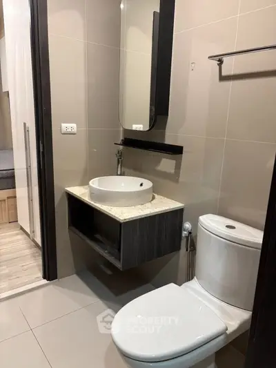 Modern bathroom with sleek fixtures and elegant design in a contemporary apartment.