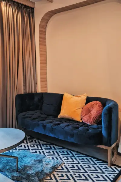 Stylish living room with modern sofa and geometric rug design