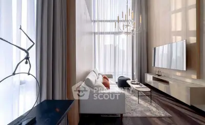 Luxurious high-ceiling living room with elegant chandelier and modern decor