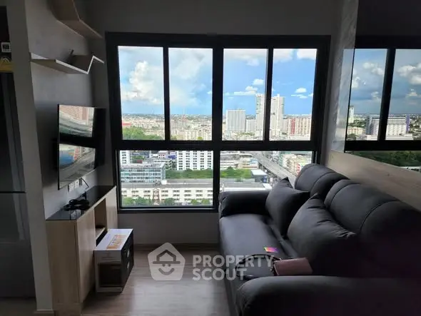 Modern living room with stunning city view and sleek black sofa