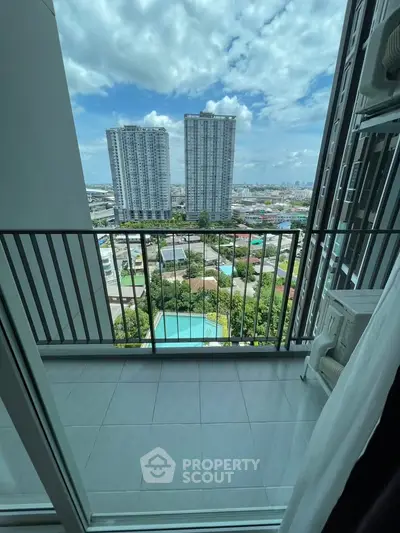 Stunning high-rise balcony view with cityscape and pool