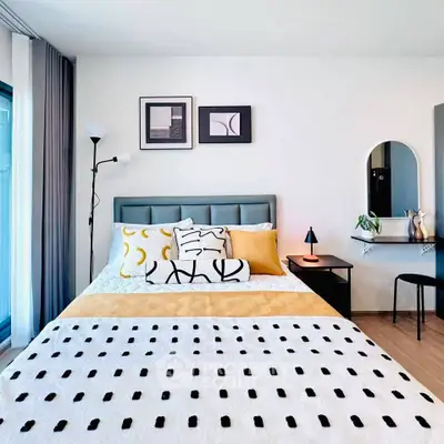 Stylish modern bedroom with elegant decor and natural light