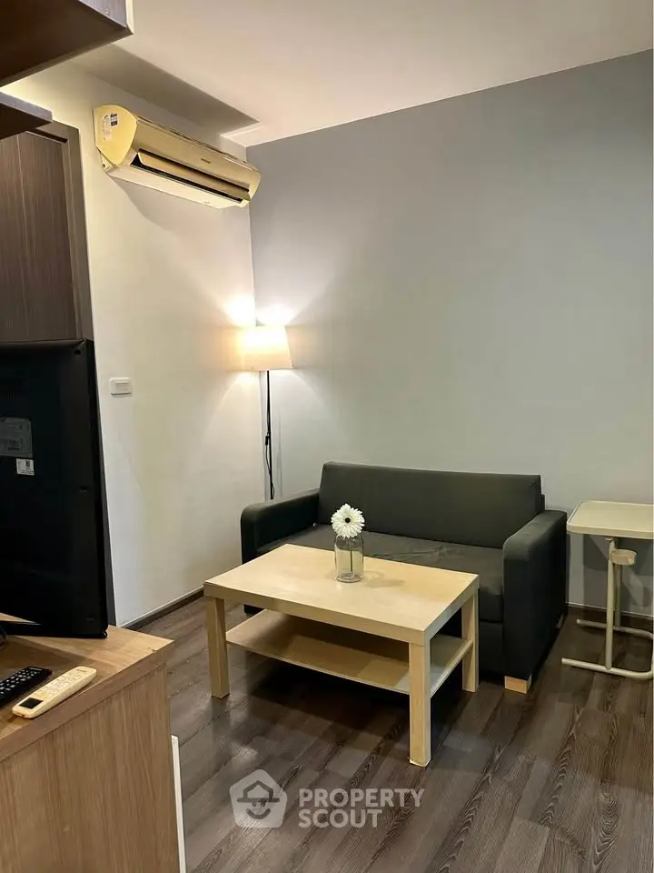 Cozy living room with modern furniture and air conditioning