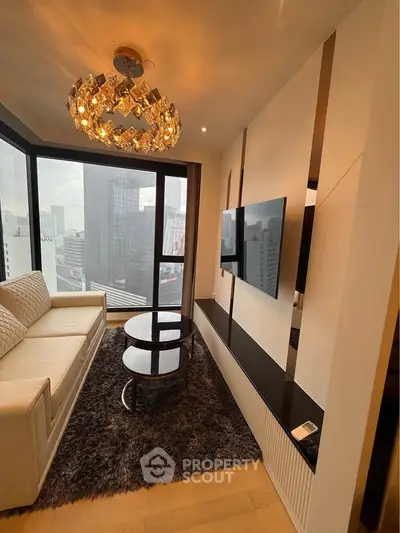 Luxurious modern living room with stunning city view and elegant chandelier