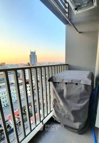 Charming balcony with city view, perfect for relaxing and enjoying sunsets in urban living.