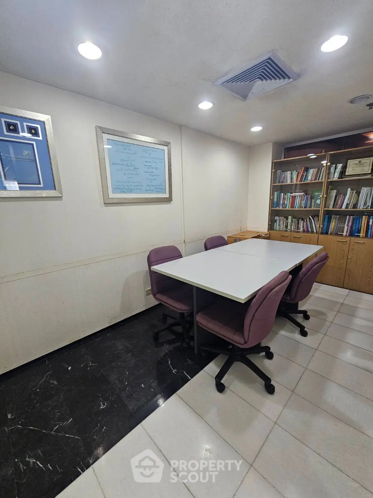 Cozy study room with modern furniture and built-in bookshelves