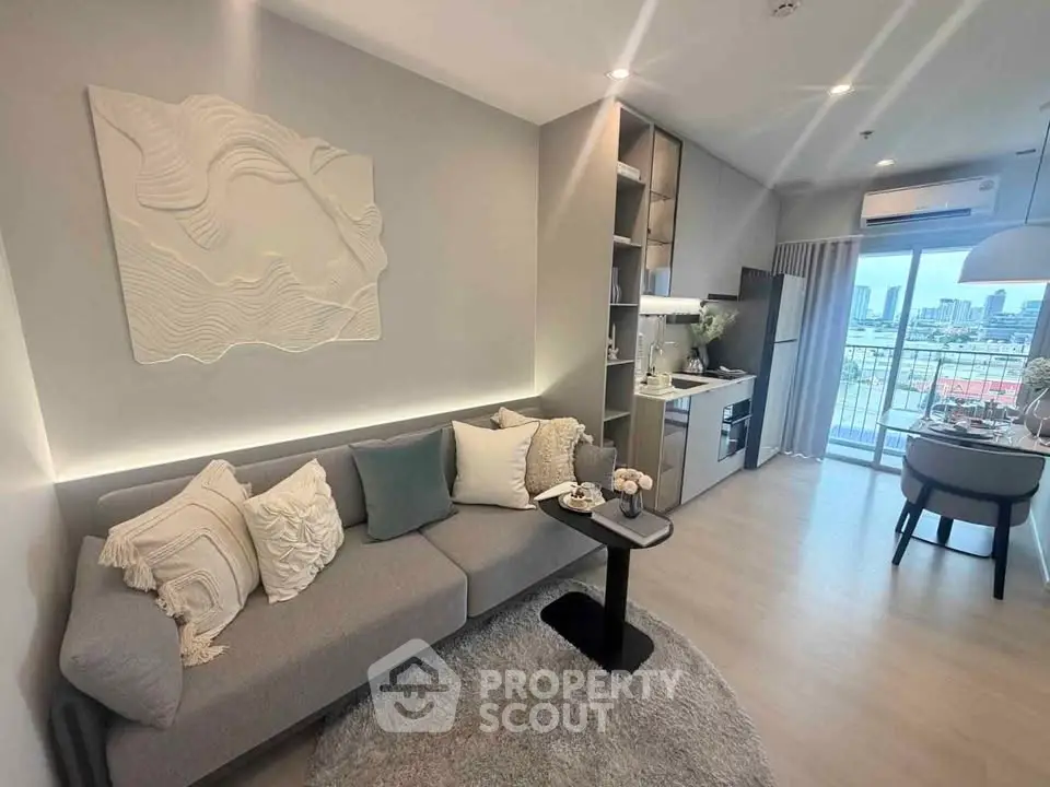Modern living room with stylish decor and city view balcony in a chic apartment.