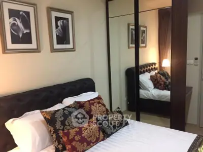 Elegant bedroom with mirrored wardrobe and stylish decor