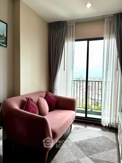 Chic living room with plush sofa and city view from balcony, perfect for urban living.