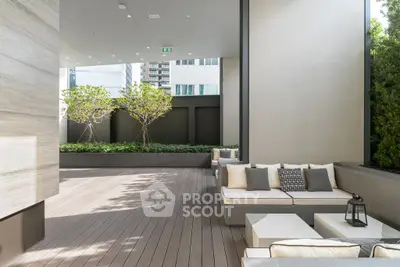 Luxurious modern terrace with stylish seating and lush greenery