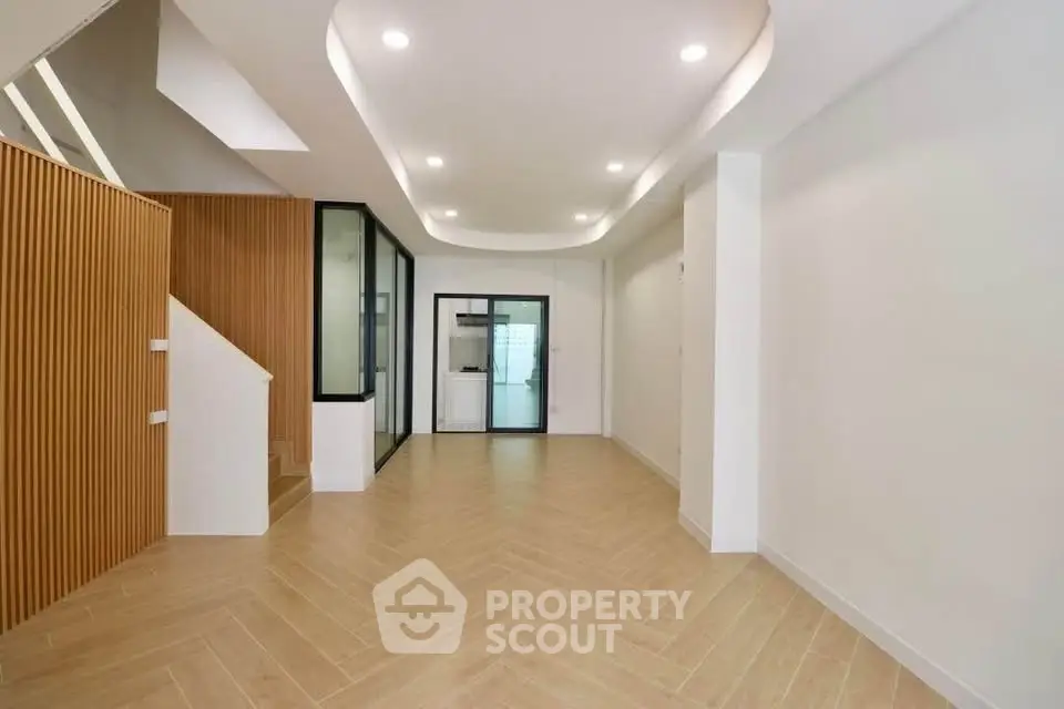 Modern minimalist interior with wooden accents and recessed lighting