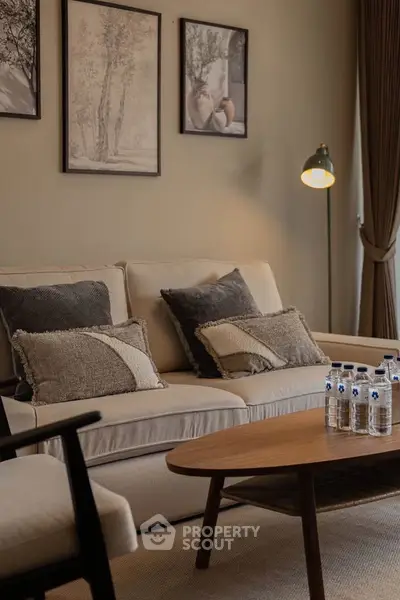 Elegant living room with cozy beige sofa, stylish decor, and warm lighting creating a welcoming ambiance.