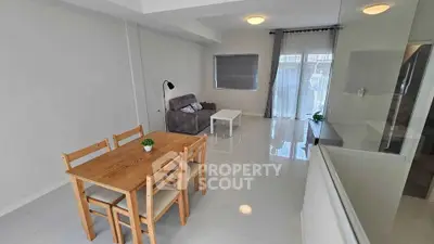 Spacious modern living room with dining area and natural light