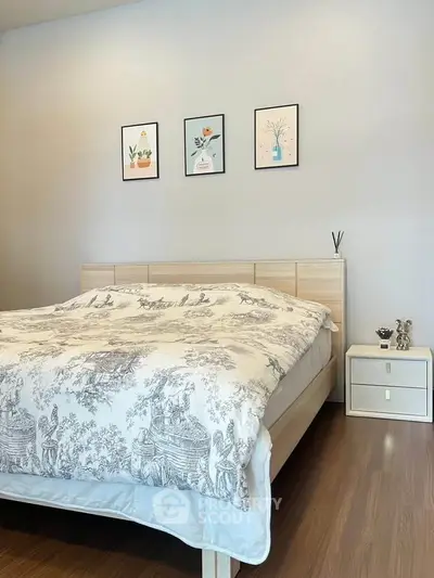 Cozy bedroom with stylish decor and wooden flooring