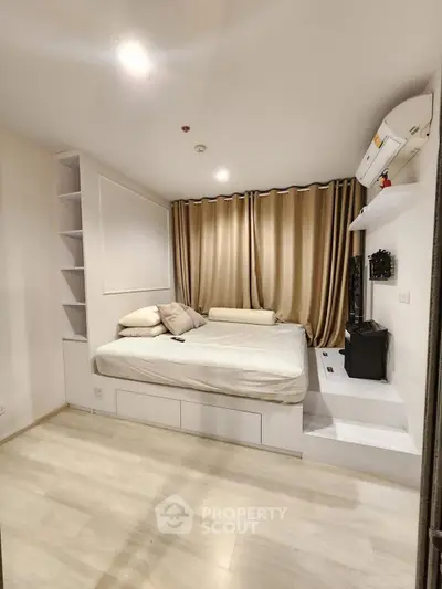 Modern bedroom with built-in storage and elegant curtains