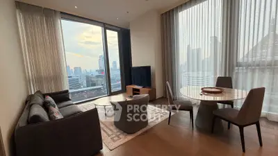 Spacious living room with stunning city view, modern furniture, and elegant decor in a high-rise apartment.