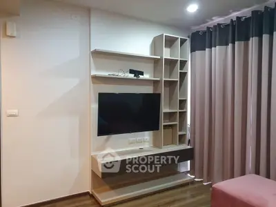 Modern living room with sleek TV unit and stylish curtains, perfect for contemporary living.