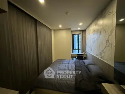 Modern bedroom with sleek design and city view window