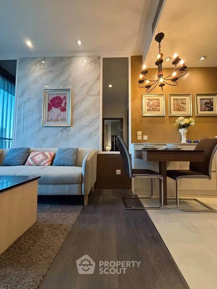 Elegant living and dining area with modern decor and stylish lighting