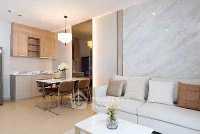 Modern living room with elegant marble wall and cozy dining area