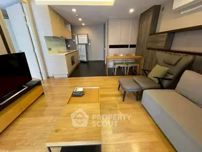 Modern living room with open kitchen and stylish furniture