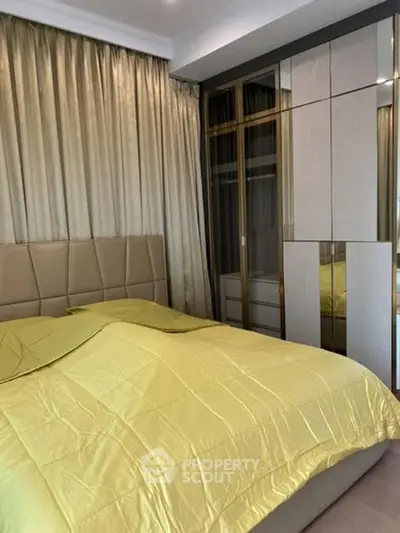 Luxurious bedroom with elegant decor and mirrored wardrobe