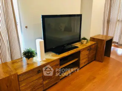 Stylish living room with wooden TV stand and modern decor