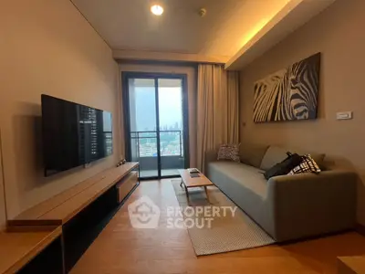 Modern living room with balcony and city view, featuring stylish decor and comfortable seating.