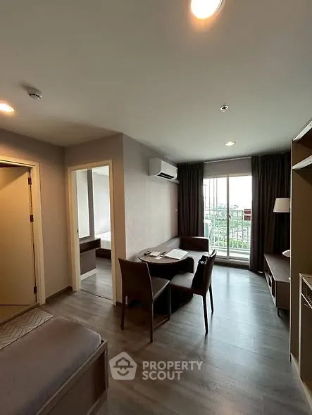 Modern living room with balcony view and stylish furniture