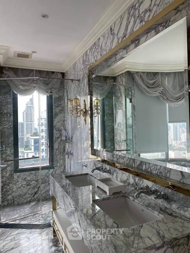 Luxurious marble bathroom with city view and elegant fixtures