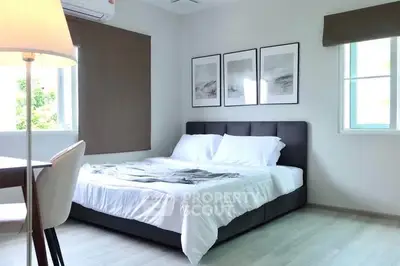 Modern bedroom with stylish decor and natural light