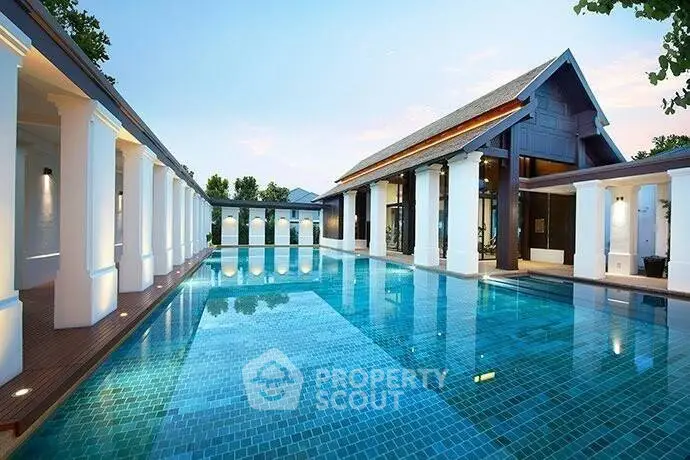Luxurious outdoor pool with elegant architecture and serene surroundings