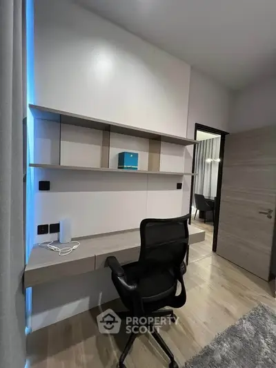 Modern study room with sleek desk and ergonomic chair, perfect for productivity.