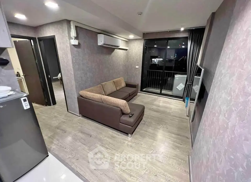 Modern living room with sleek design and balcony view in urban apartment