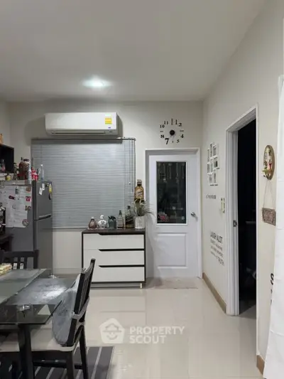 Modern kitchen with sleek dining area and stylish decor