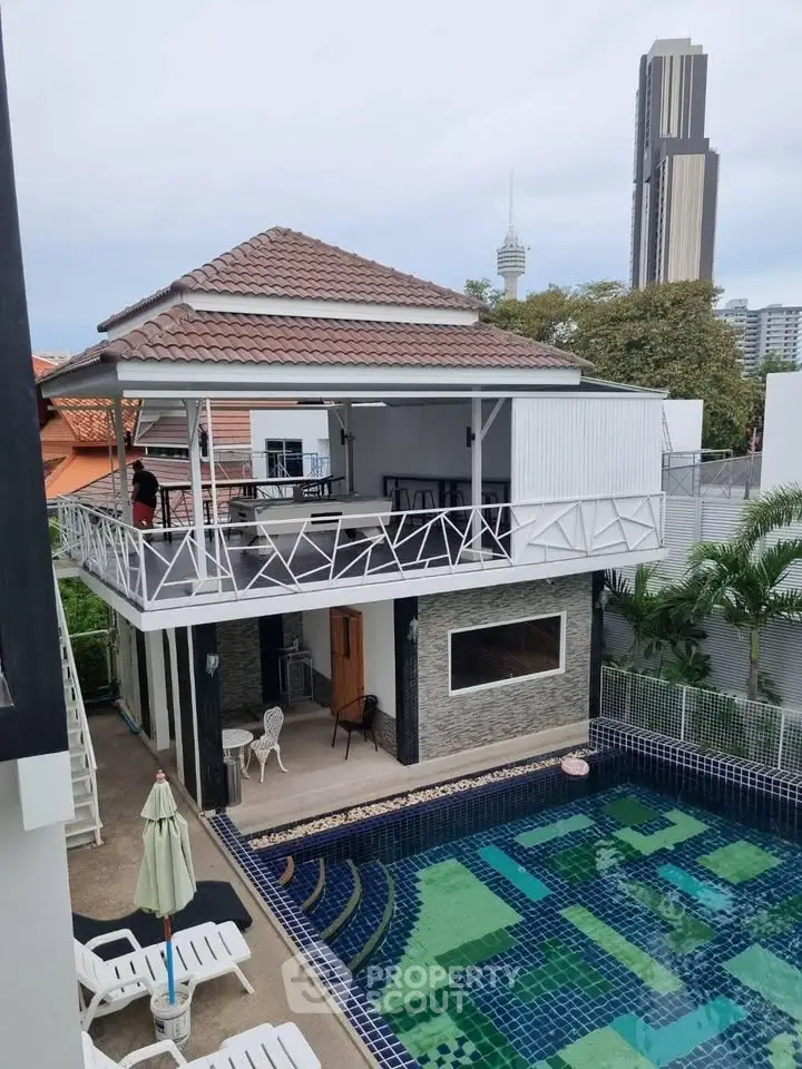 Stunning two-story villa with private pool and spacious balcony, offering a luxurious urban retreat.