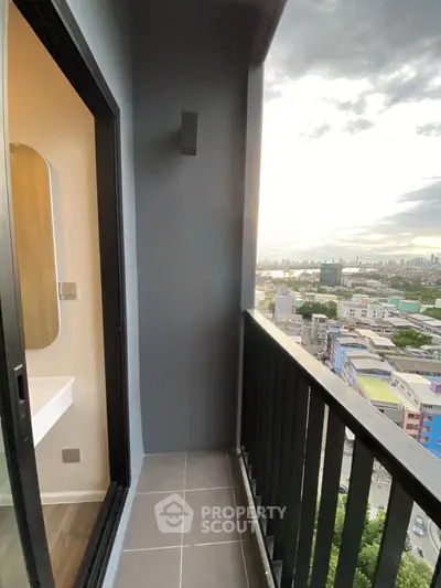 Modern balcony with stunning city view, perfect for relaxation and enjoying sunsets.