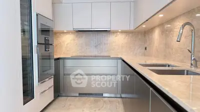 Modern kitchen with sleek cabinetry and stainless steel appliances