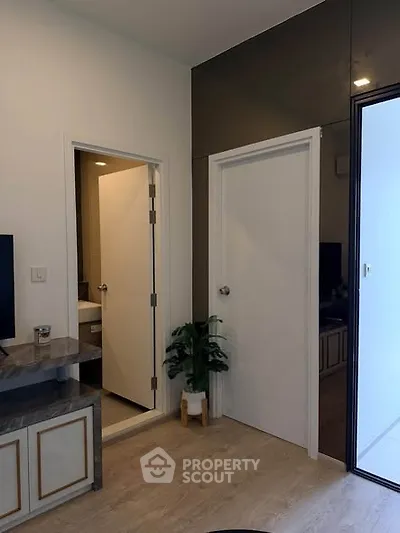 Modern interior with sleek doors and stylish decor in a contemporary apartment.