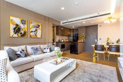 Luxurious modern living room with elegant decor and open kitchen layout