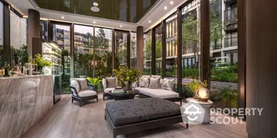 Luxurious modern living room with floor-to-ceiling windows and garden view