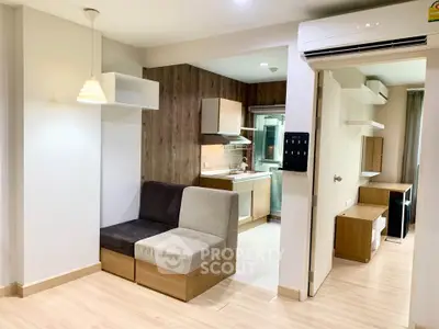 Modern open-layout apartment with stylish kitchen and cozy living area, perfect for urban living.