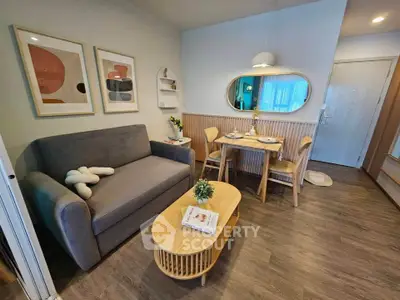 Chic modern living room with stylish decor and cozy dining area, perfect for urban living.