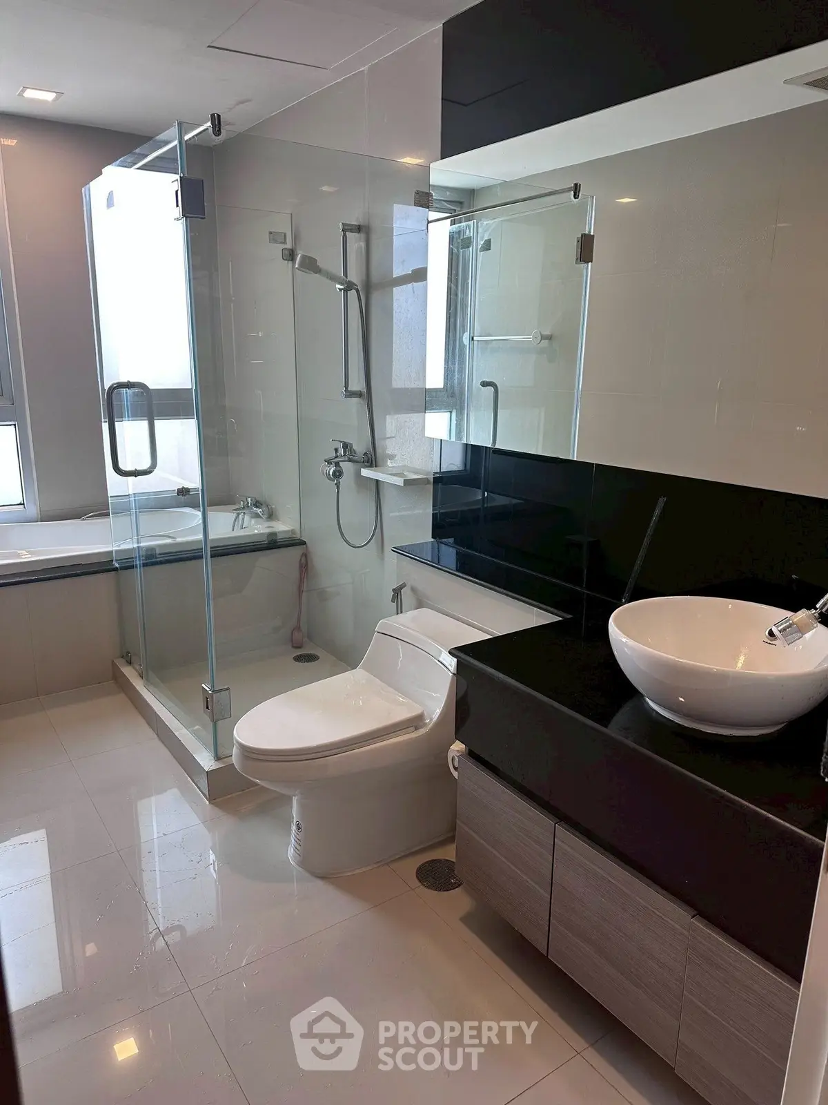 Modern bathroom with glass shower and sleek fixtures