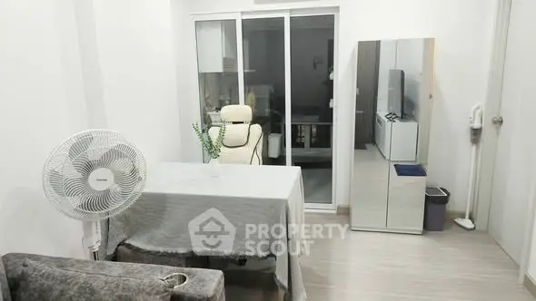 Modern living room with sleek furniture and sliding glass doors