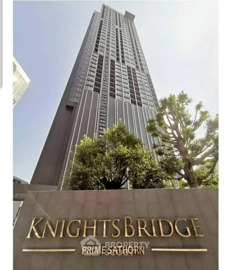 Stunning high-rise building exterior at Knightsbridge Prime Sathorn with lush greenery.